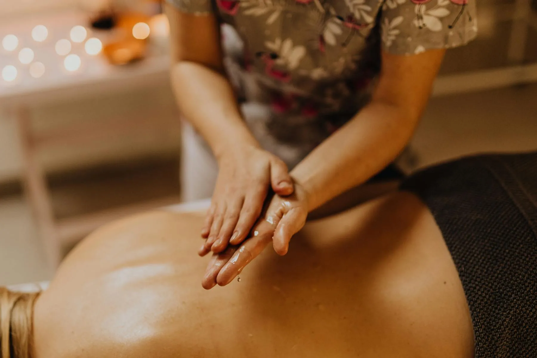 Hands preparing for a massage session