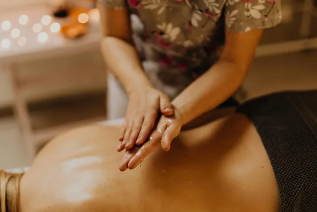 Hands preparing for a massage session